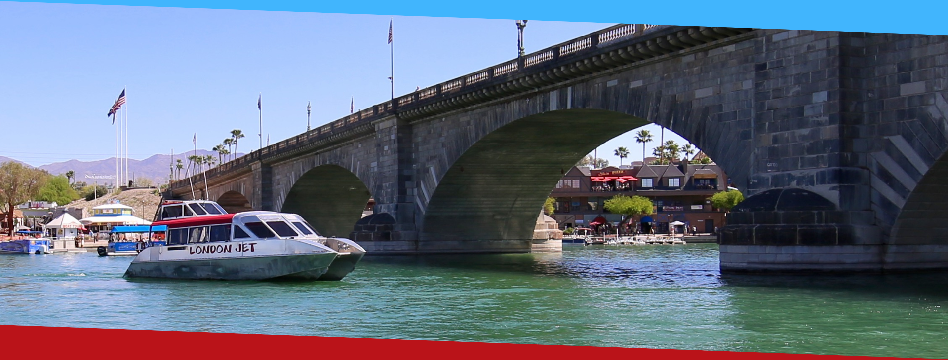 a boat traveling across a bridge over a body of water