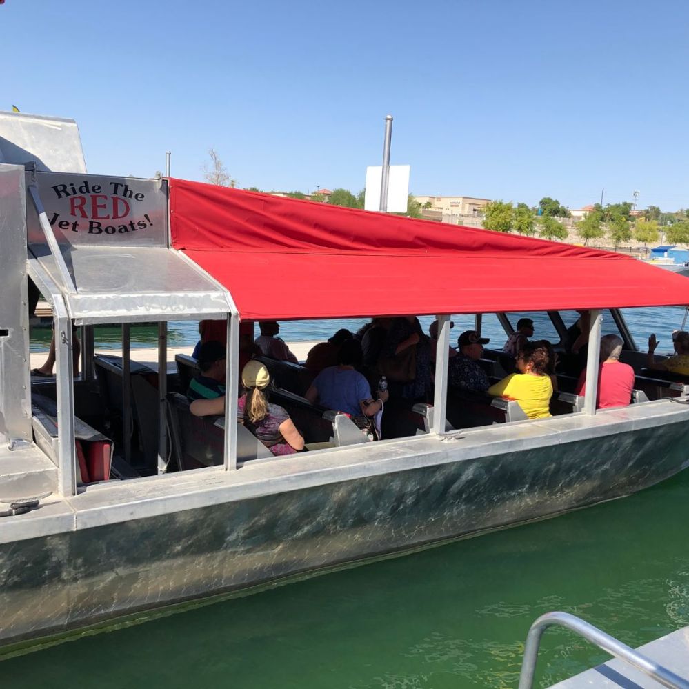 a group of people sitting on a boat