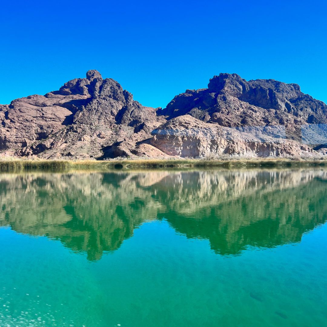 a lake with a mountain in the background