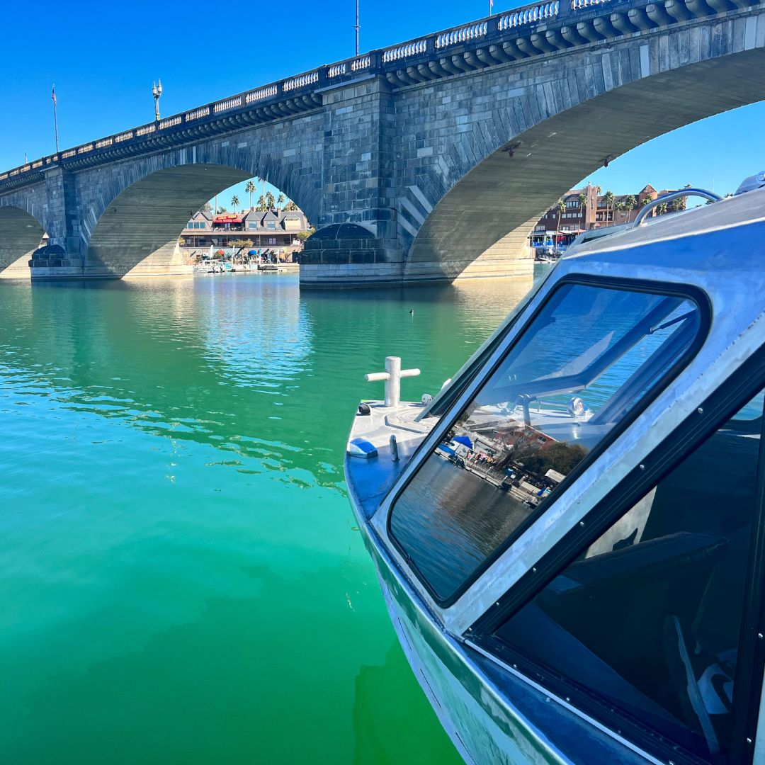 a boat on the water near the London Bridge