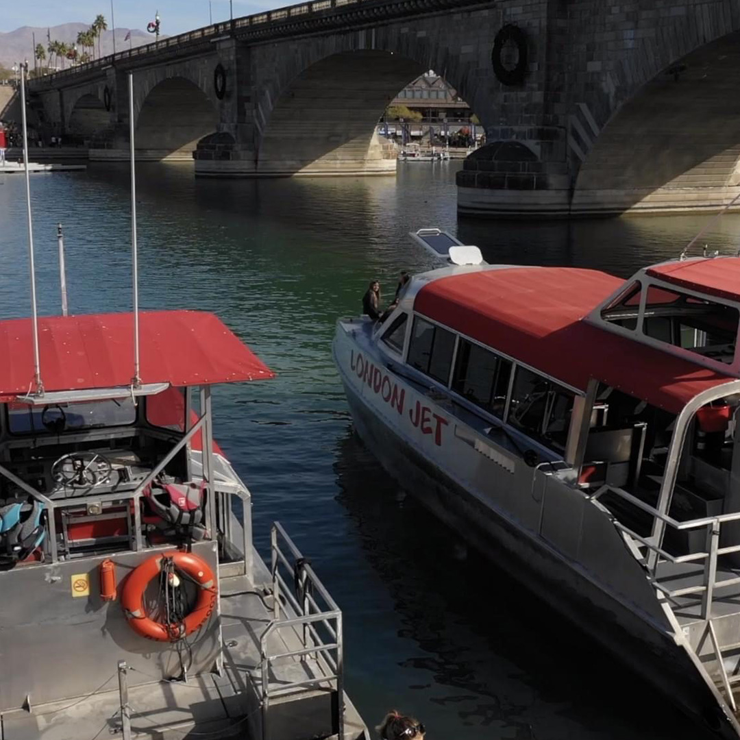 a boat is docked next to a body of water