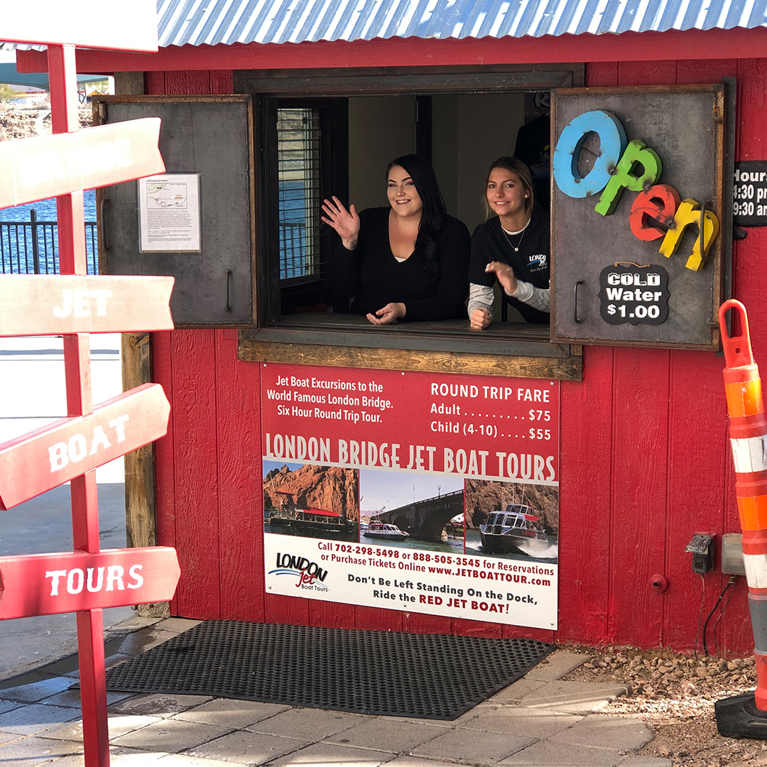 a group of people standing in front of a store