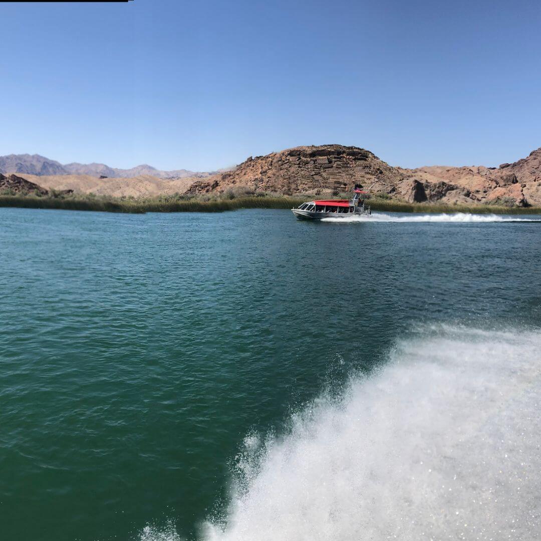 a body of water with a mountain in the background