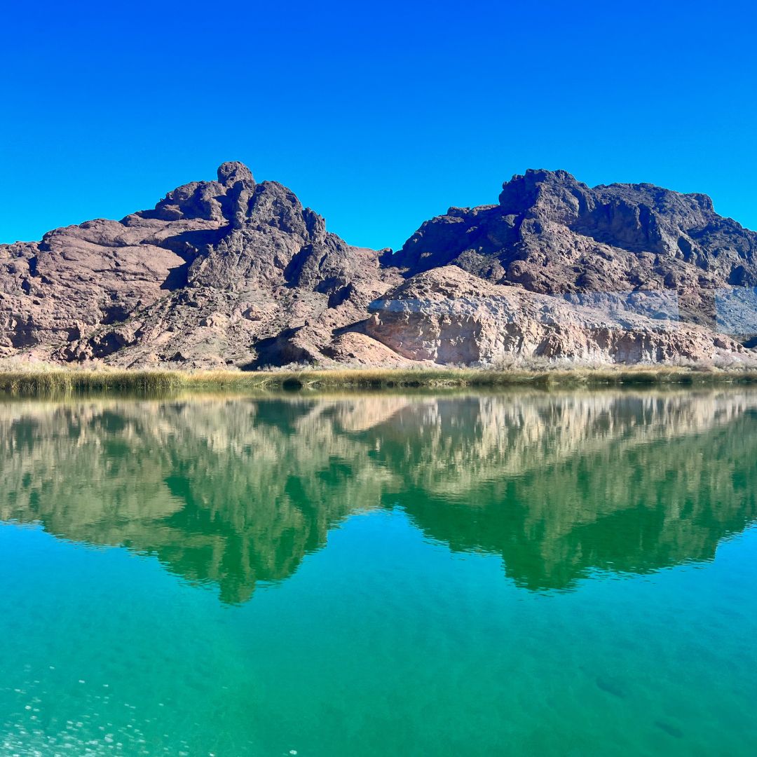 a lake with a mountain in the background